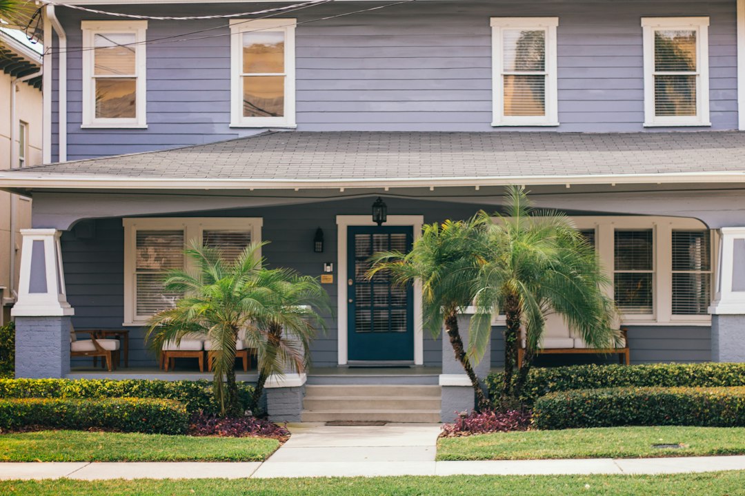 Home inspector examining the exterior of a luxury Florida home before it is listed for sale