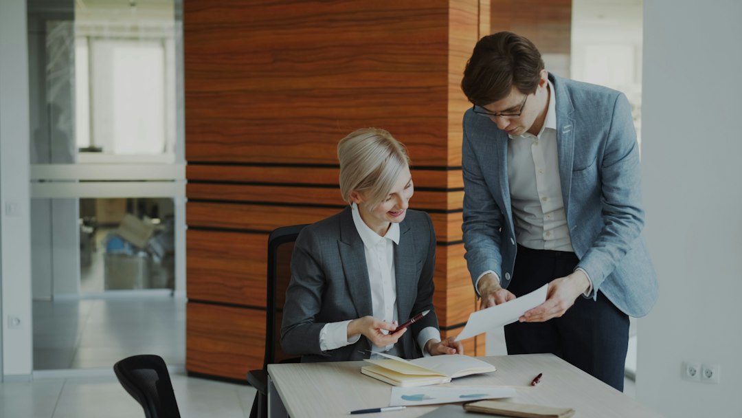 Commercial real estate advisor and owner reviewing sale-leaseback lease documents in South Florida